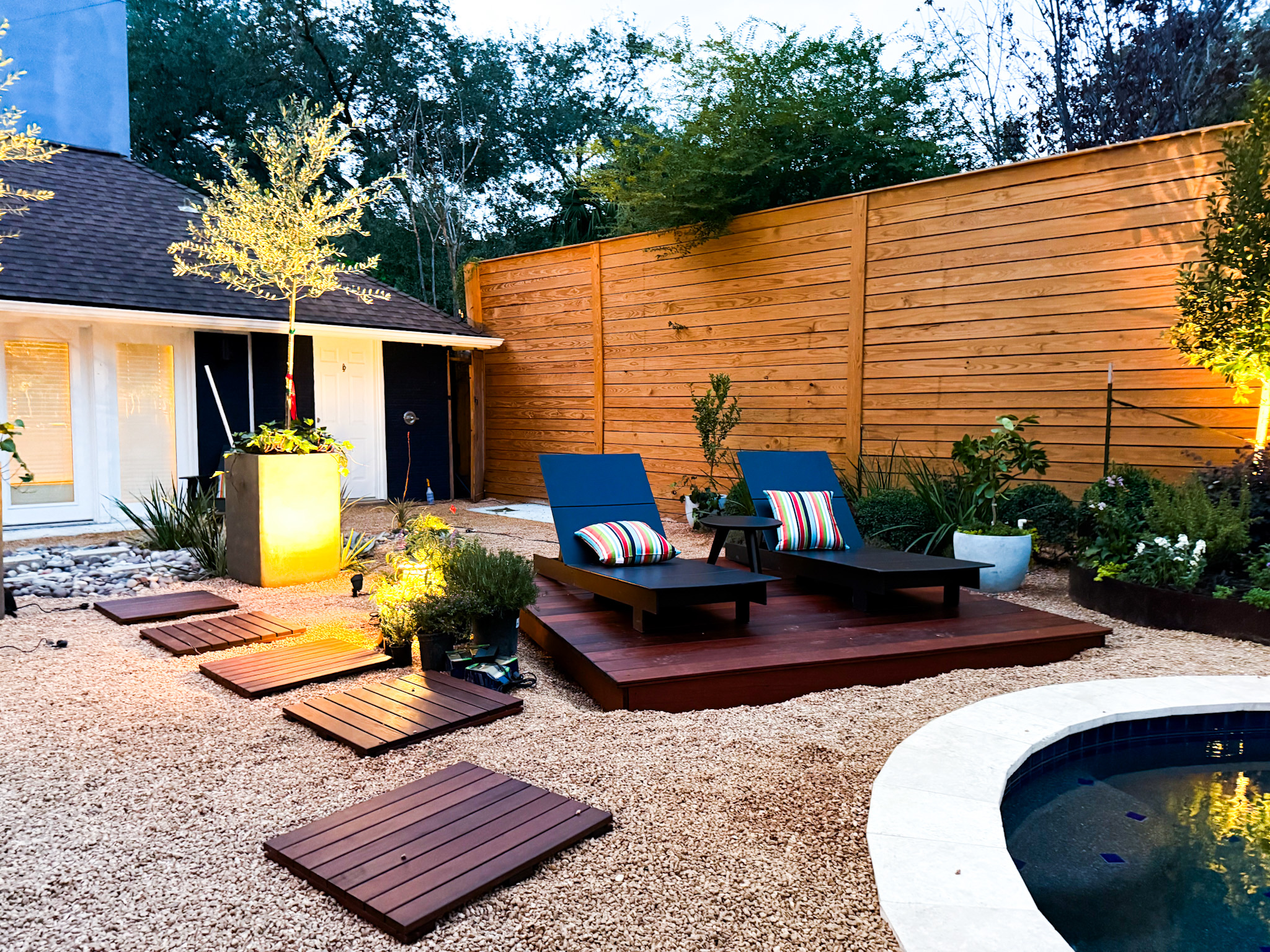 Professional landscape lighting installation in Houston - architectural uplighting at night
